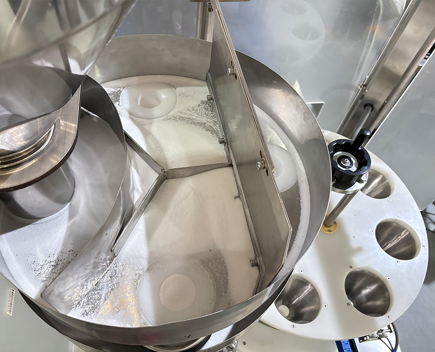 Máquina dosificadora de vasos medidores, máquina rotativa receptora de vasos medidores, máquina receptora cuantitativa de material granular de sal